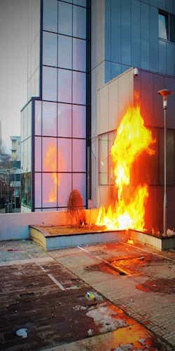 A modern building in fire
