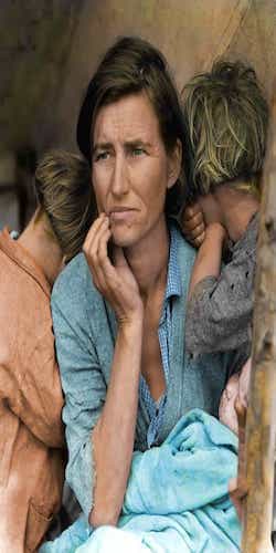 a refugee woman with her hands on her chin and her two children